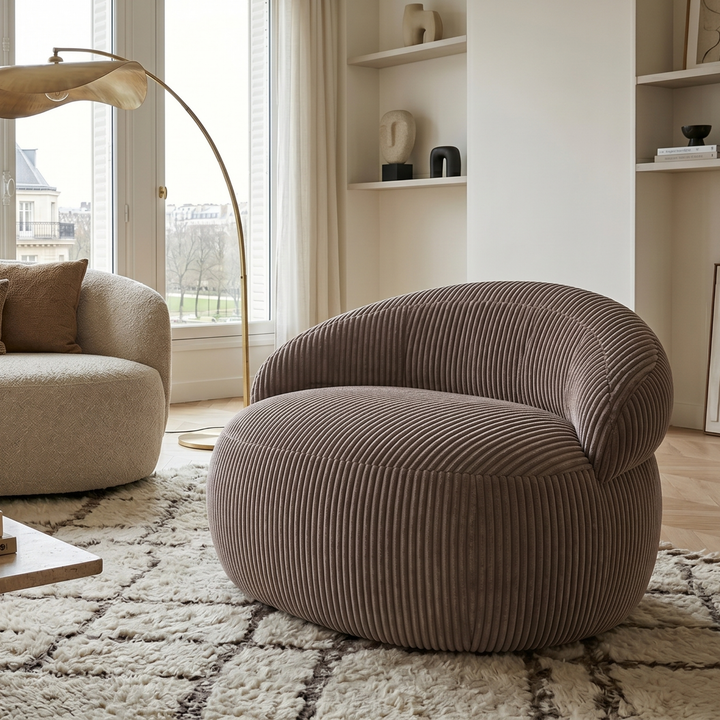 Pouf XXL déhoussable en velours côtelé, forme arrondie, dans un salon