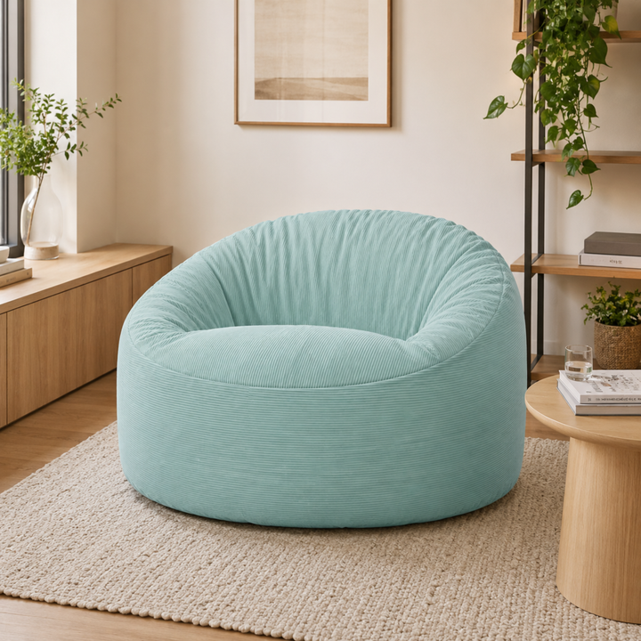 Pouf rond en velours côtelé dans un salon