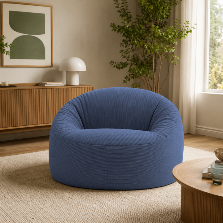 Pouf déhoussable rond en velours côtelé bleu foncé, vue en intérieur