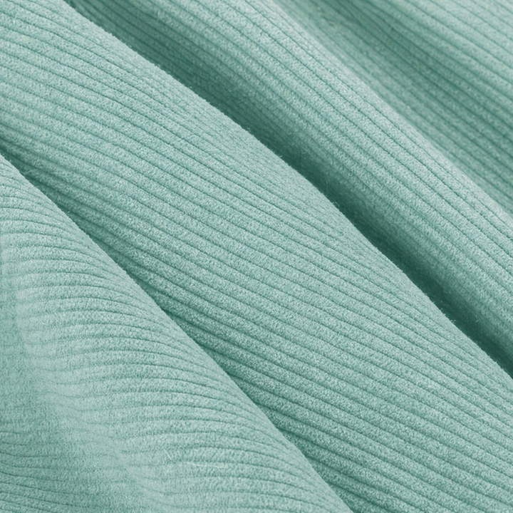 Détail du velours côtelé du pouf, reliefs horizontaux