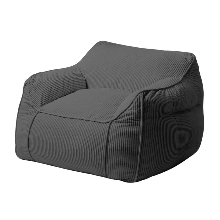 Pouf fauteuil velours côtelé gris foncé, accoudoirs arrondis, assise et dossier rembourrés