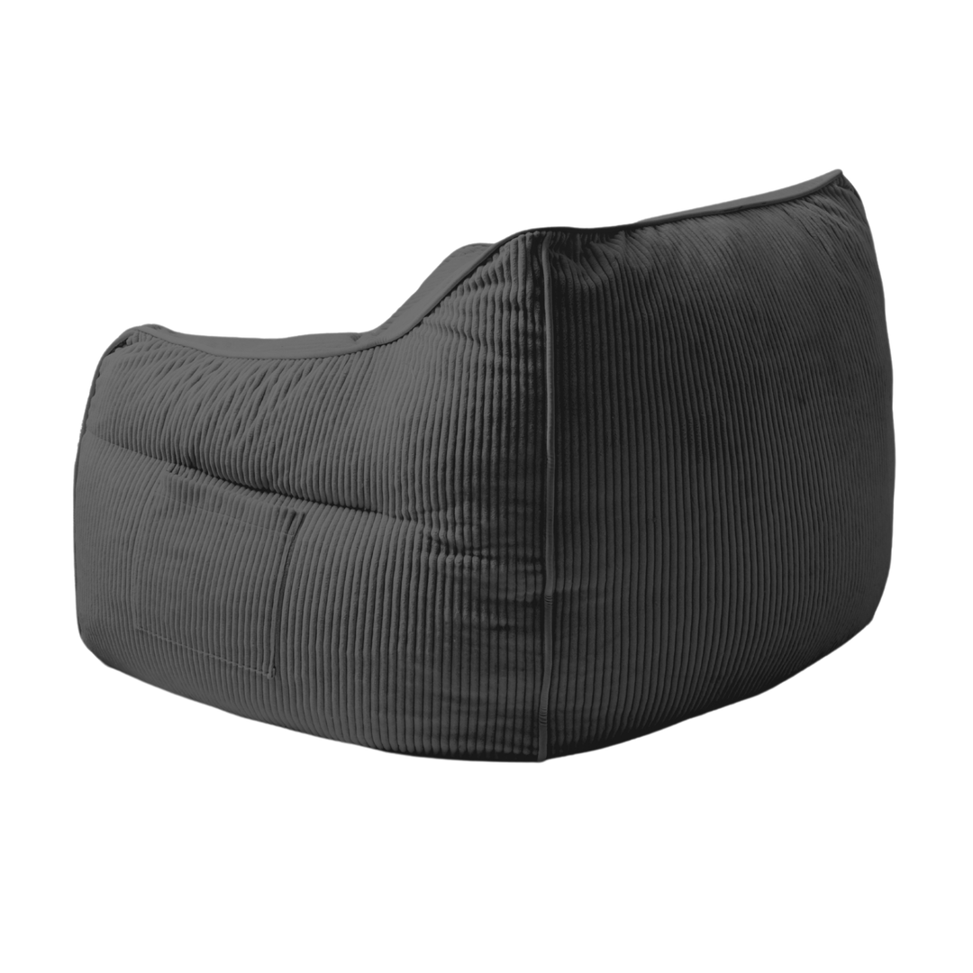 Pouf fauteuil en velours côtelé gris foncé, vue trois-quarts