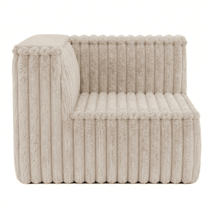 Module d’angle gauche pour canapé modulable déhoussable en fourrure côtelée beige, forme compacte.